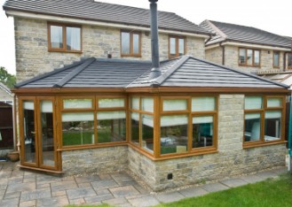 A Conservatory Conversion with an Insulated & Solid Tiled Roof System liughtweight roof